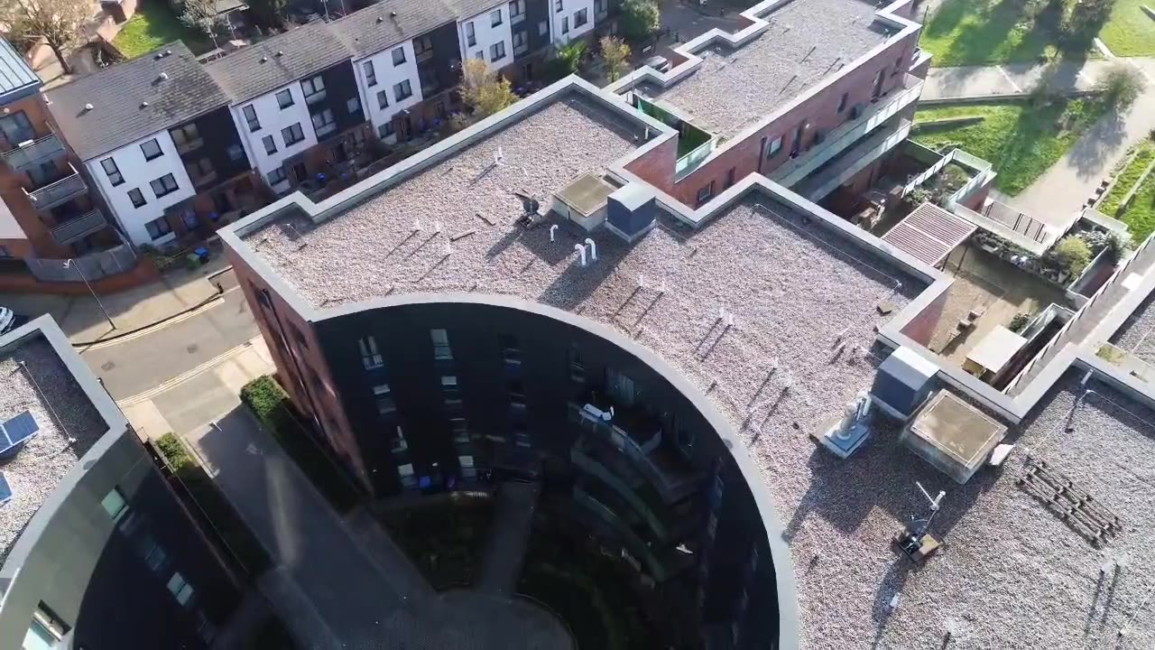 Aerial view of roof coverings and a courtyard from the supplied drone footage
