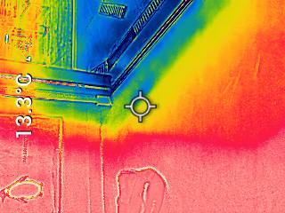 Thermographic inspection image of a window corner and adjoining wall